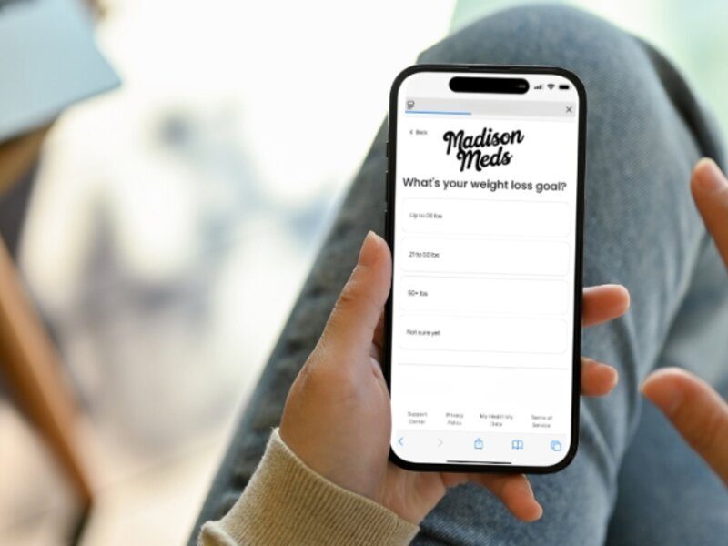 Person completing health questionnaire on phone